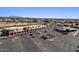 Commercial area with parking lot and various shops and businesses at 2261 N Demaret Dr, Mesa, AZ 85215