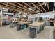 Well-equipped workshop featuring ample workbenches and storage shelving at 2261 N Demaret Dr, Mesa, AZ 85215