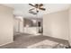 Spacious upstairs hallway with ceiling fan and carpet at 23582 W Wier Ave, Buckeye, AZ 85326