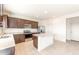 Modern kitchen with island, stainless steel appliances, and granite counters at 24387 W Flores Dr, Buckeye, AZ 85326