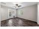 Bright bedroom with wood-look floors and ceiling fan at 2534 E Maryland Dr, Tempe, AZ 85288