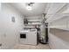 Laundry room with washer, dryer, and shelving at 2534 E Maryland Dr, Tempe, AZ 85288