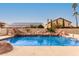 Inviting swimming pool with rock waterfall feature at 434 S Jared Dr, Gilbert, AZ 85296