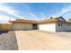 Newly renovated single-story home with a large driveway and gravel landscaping at 5534 N 42Nd Ln, Phoenix, AZ 85019