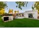 Spacious backyard with a pool and grassy area at 8508 E Mustang Trl, Scottsdale, AZ 85258