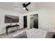 Serene bedroom with a queen-size bed and large wall-mounted TV at 8508 E Mustang Trl, Scottsdale, AZ 85258