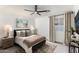Cozy bedroom with a full-size bed, ample natural light and tasteful decor at 8508 E Mustang Trl, Scottsdale, AZ 85258