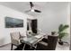 Bright home office features a glass desk, comfortable chairs, and stylish decor at 8508 E Mustang Trl, Scottsdale, AZ 85258