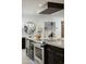 Modern kitchen island with high-end Wolf range and built-in appliances at 8508 E Mustang Trl, Scottsdale, AZ 85258