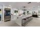 Modern kitchen with white cabinets, a large island, and stainless steel appliances at 8508 E Mustang Trl, Scottsdale, AZ 85258