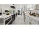 Sleek kitchen with dark cabinetry and white countertops at 8508 E Mustang Trl, Scottsdale, AZ 85258