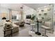 Bright living room with a cozy sectional sofa and built-in wine storage at 8508 E Mustang Trl, Scottsdale, AZ 85258