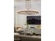 Elegant living room features a large TV, comfortable seating, and a stunning chandelier at 8508 E Mustang Trl, Scottsdale, AZ 85258