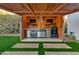 Luxury outdoor kitchen featuring a grill and beverage fridge at 8508 E Mustang Trl, Scottsdale, AZ 85258