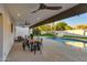Outdoor patio with pool views and ceiling fans at 8508 E Mustang Trl, Scottsdale, AZ 85258