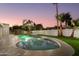 Relaxing kidney-shaped pool surrounded by lush landscaping at 8508 E Mustang Trl, Scottsdale, AZ 85258