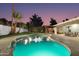 Expansive pool and spa with alluring night lighting at 8508 E Mustang Trl, Scottsdale, AZ 85258