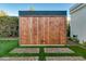 Modern storage shed with wood-paneled doors at 8508 E Mustang Trl, Scottsdale, AZ 85258
