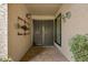 Inviting entryway with decorative metal security doors and tile flooring at 9442 E Jenan Dr, Scottsdale, AZ 85260