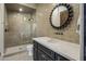 Elegant bathroom with penny tile shower and a dark vanity with quartz countertop at 9732 N Fireridge Trl, Fountain Hills, AZ 85268