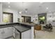 Open concept kitchen with modern appliances and a breakfast bar at 9732 N Fireridge Trl, Fountain Hills, AZ 85268