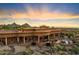 Luxury estate home nestled on a large lot with desert landscape at 9782 E Troon North Dr, Scottsdale, AZ 85262