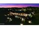 Night view of luxury home with pool and lights at 9782 E Troon North Dr, Scottsdale, AZ 85262