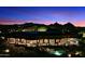 Backyard view of home with pool at night at 9782 E Troon North Dr, Scottsdale, AZ 85262