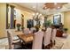 Formal dining room features a wood table and chandelier at 9782 E Troon North Dr, Scottsdale, AZ 85262