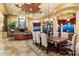Elegant dining room with a large table, chandelier, and views at 9782 E Troon North Dr, Scottsdale, AZ 85262