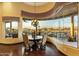 Bright dining area with panoramic views and wood floors at 9782 E Troon North Dr, Scottsdale, AZ 85262