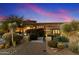 Elegant home exterior with a beautifully landscaped front yard at 9782 E Troon North Dr, Scottsdale, AZ 85262