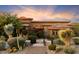 Landscaped front yard with cacti and stone at 9782 E Troon North Dr, Scottsdale, AZ 85262