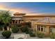 Beautiful desert landscaping with red flowers at 9782 E Troon North Dr, Scottsdale, AZ 85262