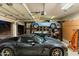 Garage with car lift and classic cars at 9782 E Troon North Dr, Scottsdale, AZ 85262