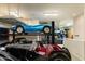 Garage with car lift and ample storage at 9782 E Troon North Dr, Scottsdale, AZ 85262