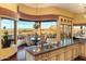 Spacious kitchen features a large island, granite counters, and stunning views at 9782 E Troon North Dr, Scottsdale, AZ 85262