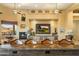 Spacious living room with a fireplace and built-in entertainment center at 9782 E Troon North Dr, Scottsdale, AZ 85262
