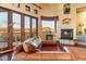 Relaxing living room with a fireplace and breathtaking views at 9782 E Troon North Dr, Scottsdale, AZ 85262