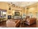Relaxing living room with leather sofas and a stunning view at 9782 E Troon North Dr, Scottsdale, AZ 85262