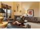 Comfortable living room with fireplace and elegant decor at 9782 E Troon North Dr, Scottsdale, AZ 85262