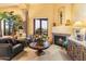Cozy living room features a fireplace and views at 9782 E Troon North Dr, Scottsdale, AZ 85262