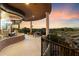 Covered patio with seating and mountain views at 9782 E Troon North Dr, Scottsdale, AZ 85262