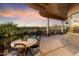 Covered patio with seating area and mountain views at 9782 E Troon North Dr, Scottsdale, AZ 85262