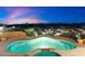 Luxury pool and spa with mountain views at sunset at 9782 E Troon North Dr, Scottsdale, AZ 85262