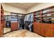 Large walk-in closet with ample shelving and hanging space at 9782 E Troon North Dr, Scottsdale, AZ 85262