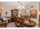 Formal dining room featuring a wood table and decorative hutch at 13106 W Lyric Dr, Sun City West, AZ 85375