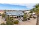 Backyard view with patio, fire pit, and desert landscaping at 14133 W Via Montoya --, Sun City West, AZ 85375