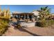 Single-story home with a covered patio and landscaped yard at 14133 W Via Montoya --, Sun City West, AZ 85375