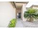 Front entry with a black door and security screen at 14741 W Avalon Dr, Goodyear, AZ 85395